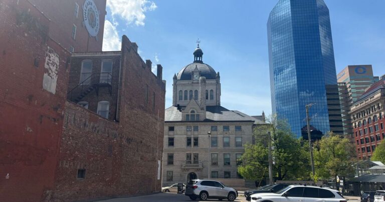 Historic Fayette County Courthouse dome with downtown Lexington Kentucky skyline